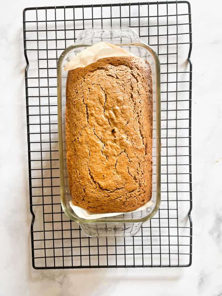 A gingerbread loaf cools in the pan.