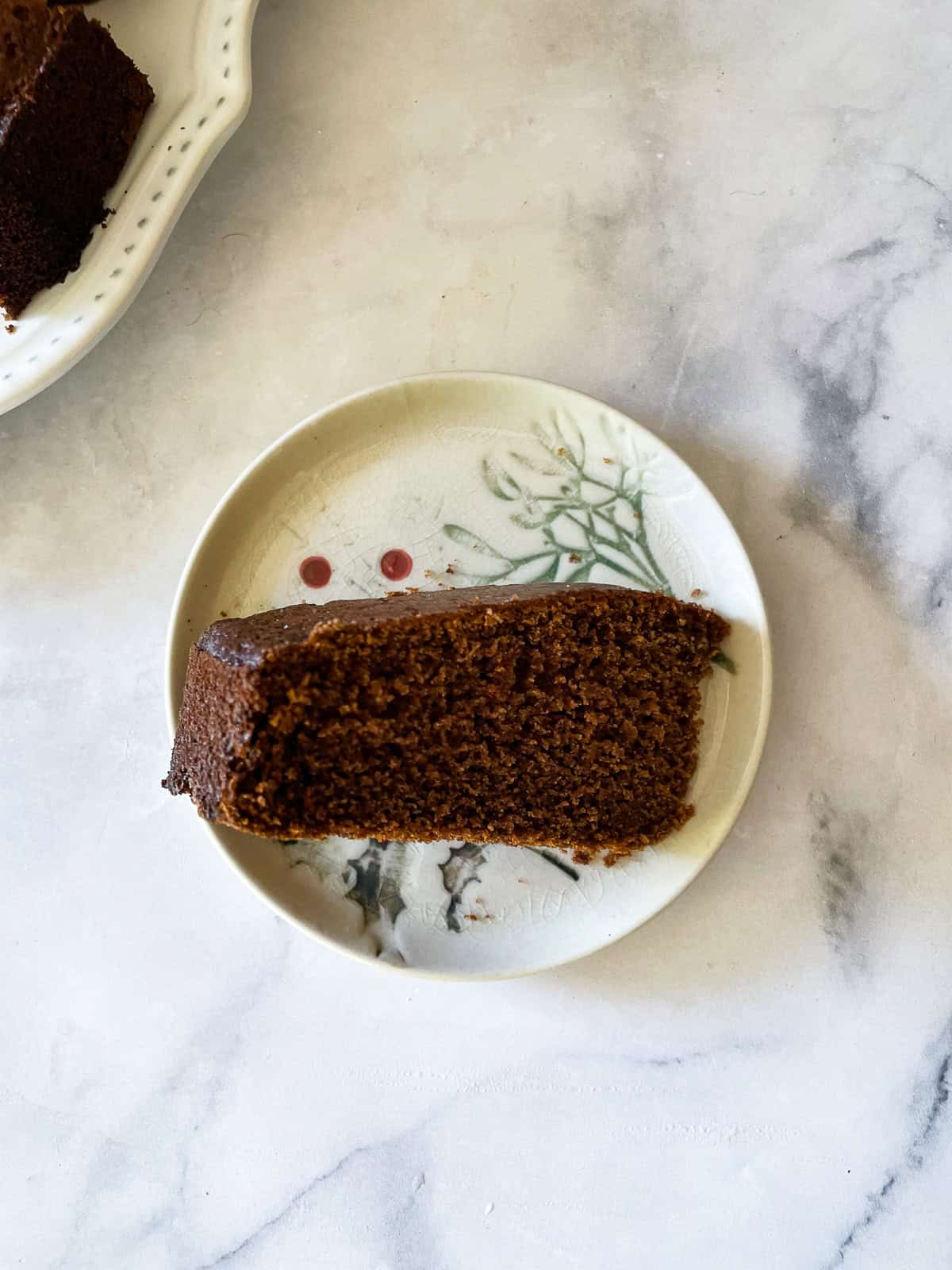 A slice of gluten-free gingerbread on its side.