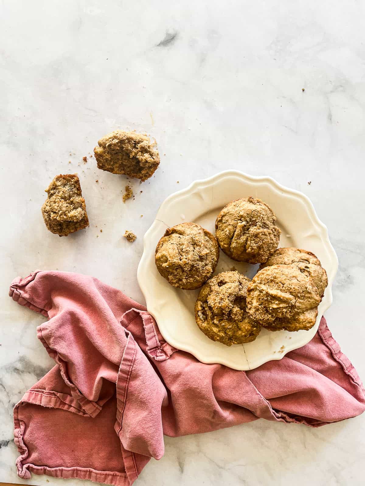 Gluten free persimmon muffins on a plate with a red napkin.