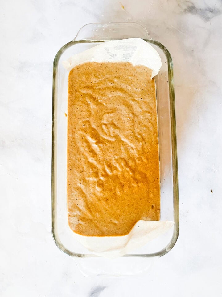 Gingerbread loaf batter in a pan.