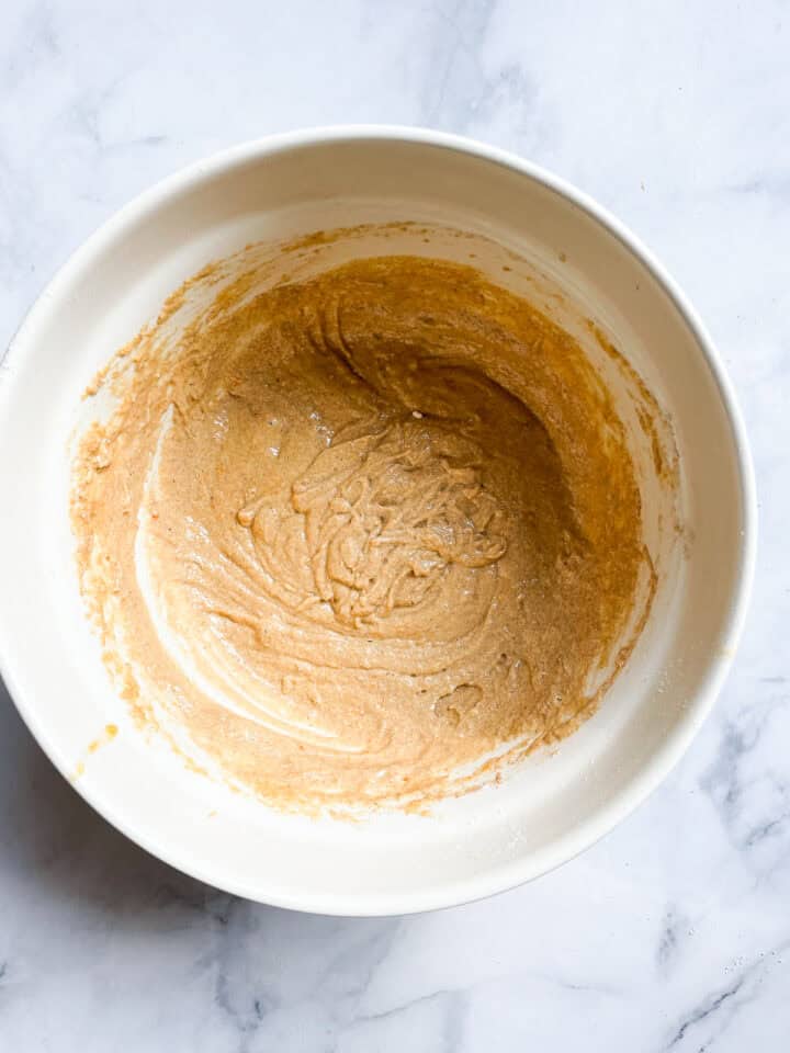 Gluten free persimmon muffin batter in a bowl.