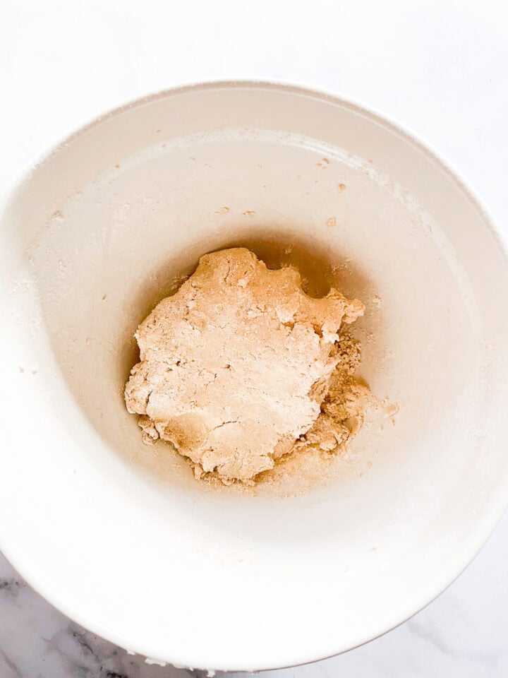 Oat flour shortbread dough in a bowl.