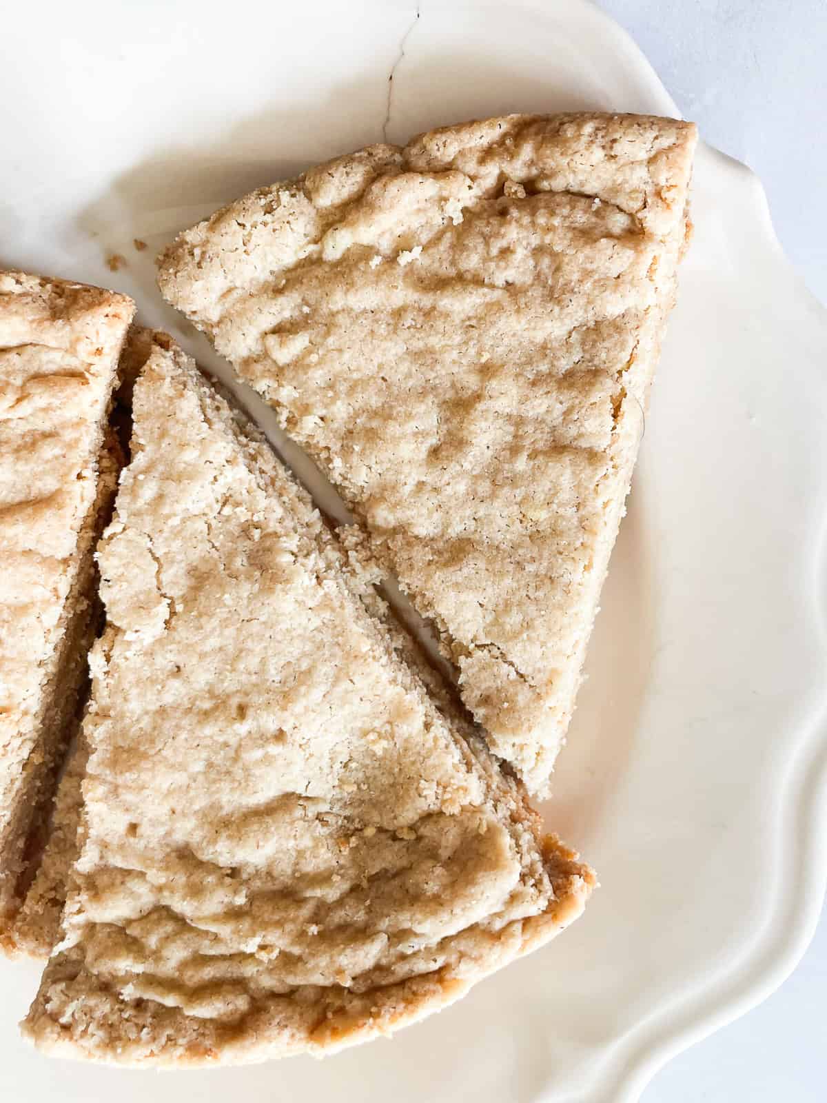 Wedges of oat flour shortbread on a plate.