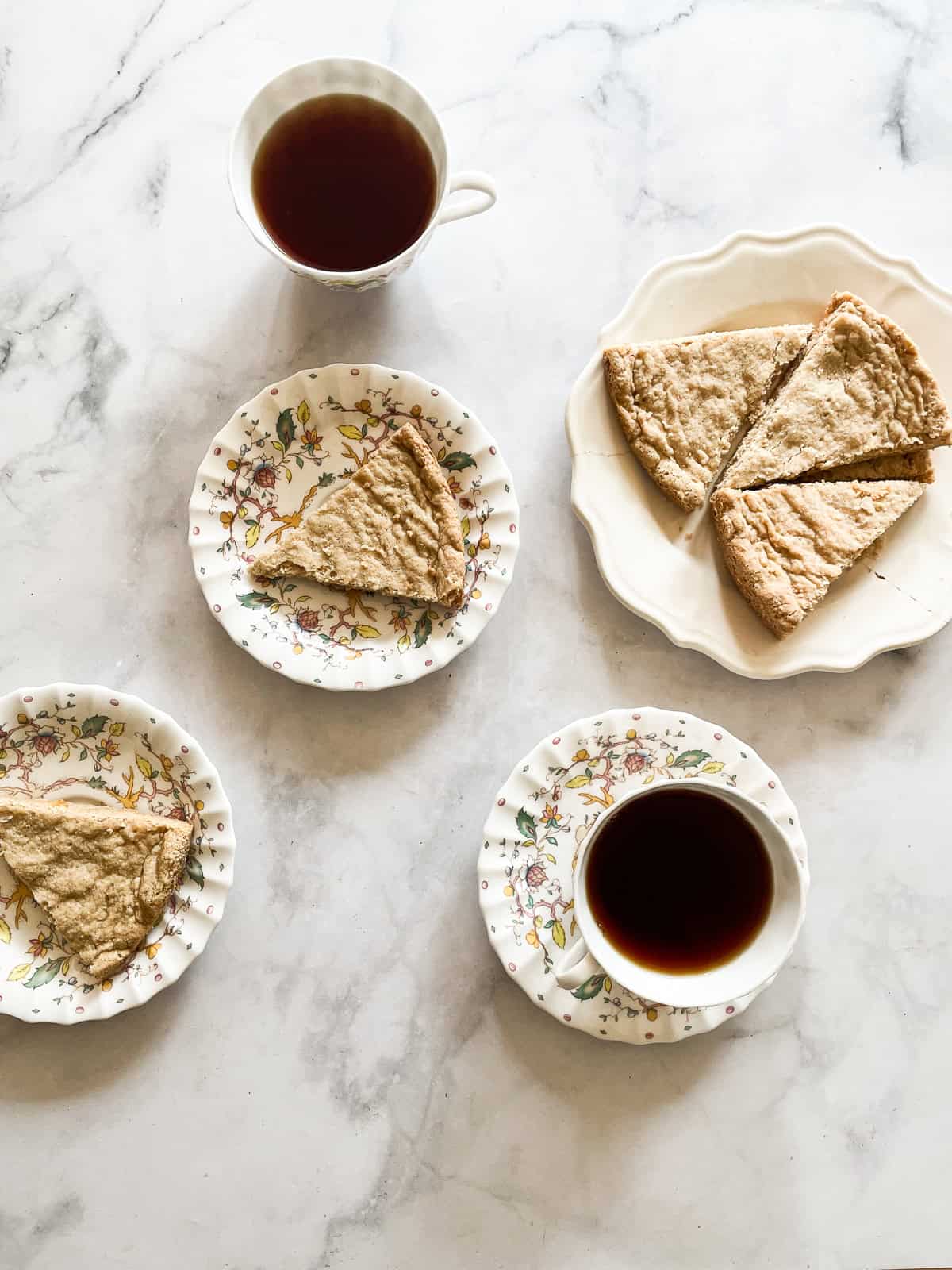 Plates of oat flour shortbread and cups of tea.