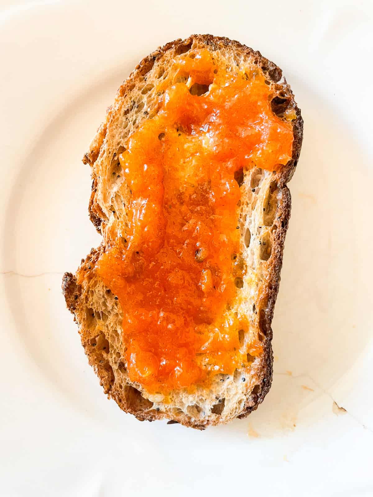 Persimmon jam spread on toast.