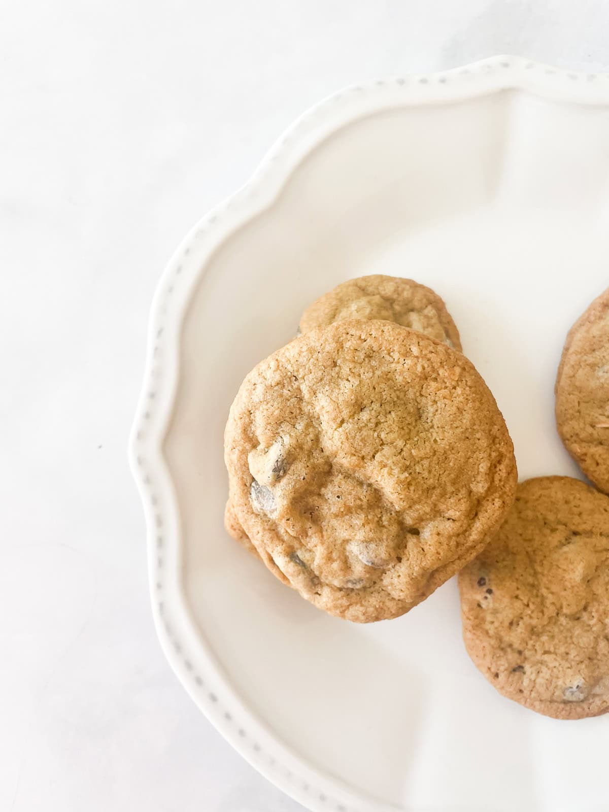 Oat flour chocolate chip cookies on a plate.