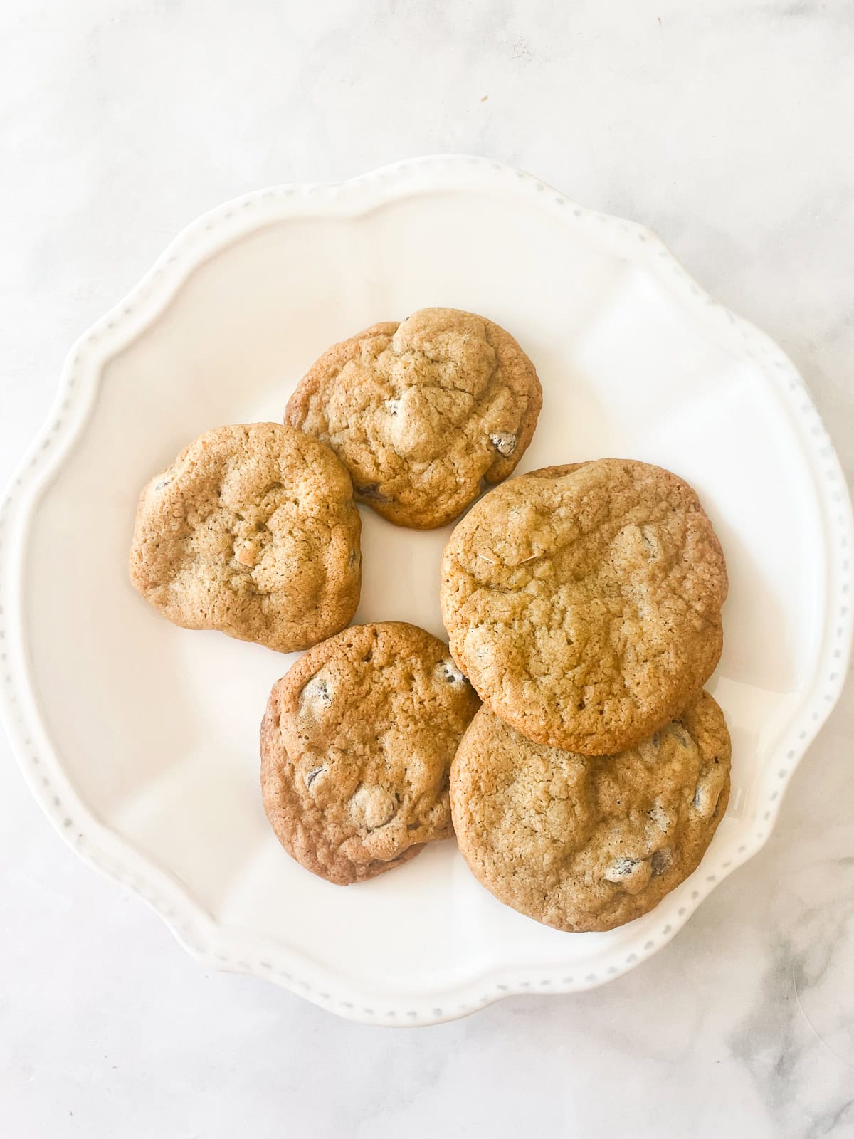 Oat flour chocolate chip cookies on a white plate.