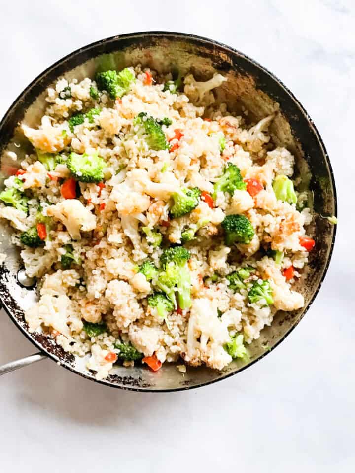 A skillet of veggies and coconut quinoa.