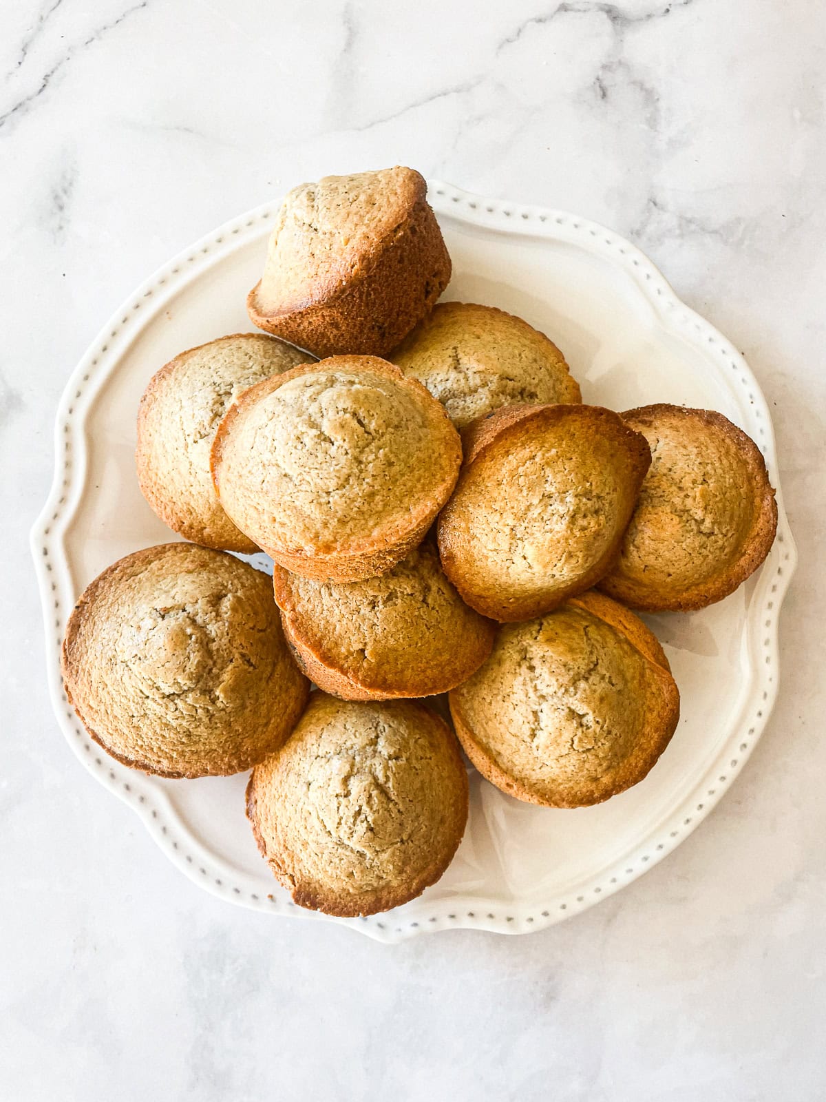 Gluten free chocolate chip muffins on a plate.