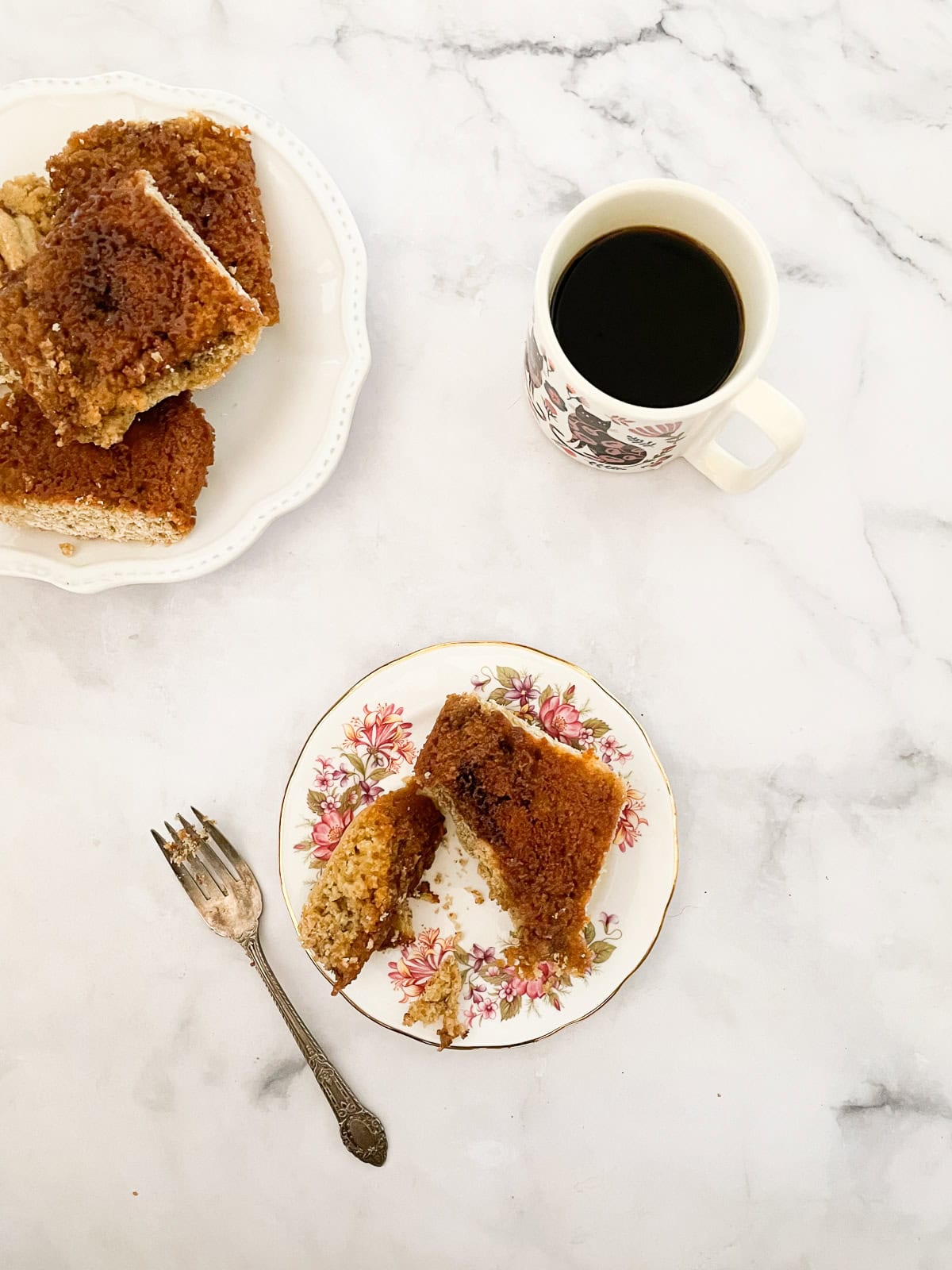 Plates of gluten-free cinnamon rolls and coffee.