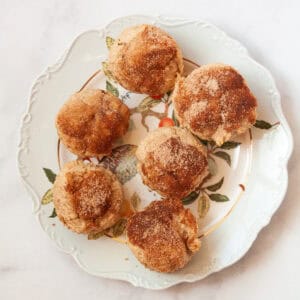 Gluten free cinnamon sugar muffins on a serving plate.