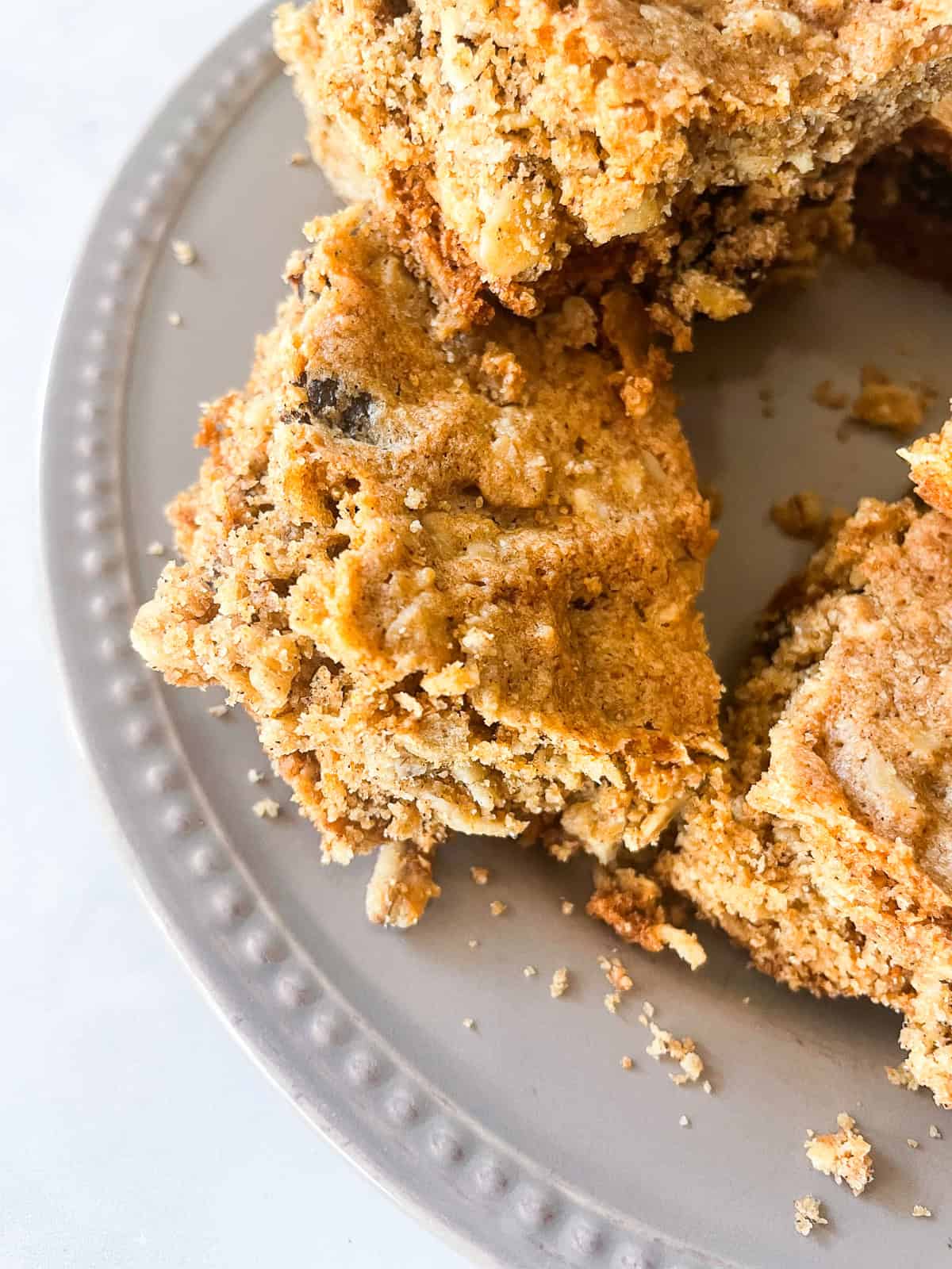 Half of a plate of oatmeal raisin bars.