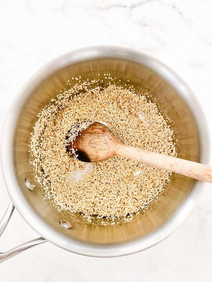 Toasting quinoa in a pot.