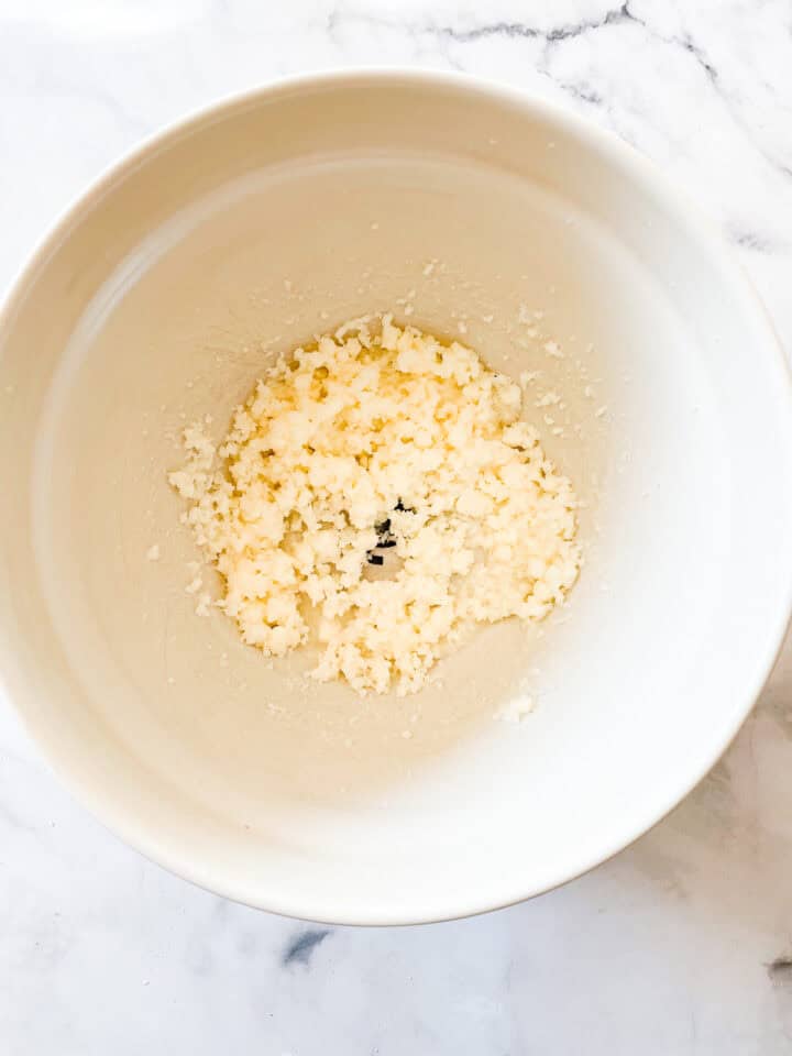 Butter creamed with sugar in a bowl.