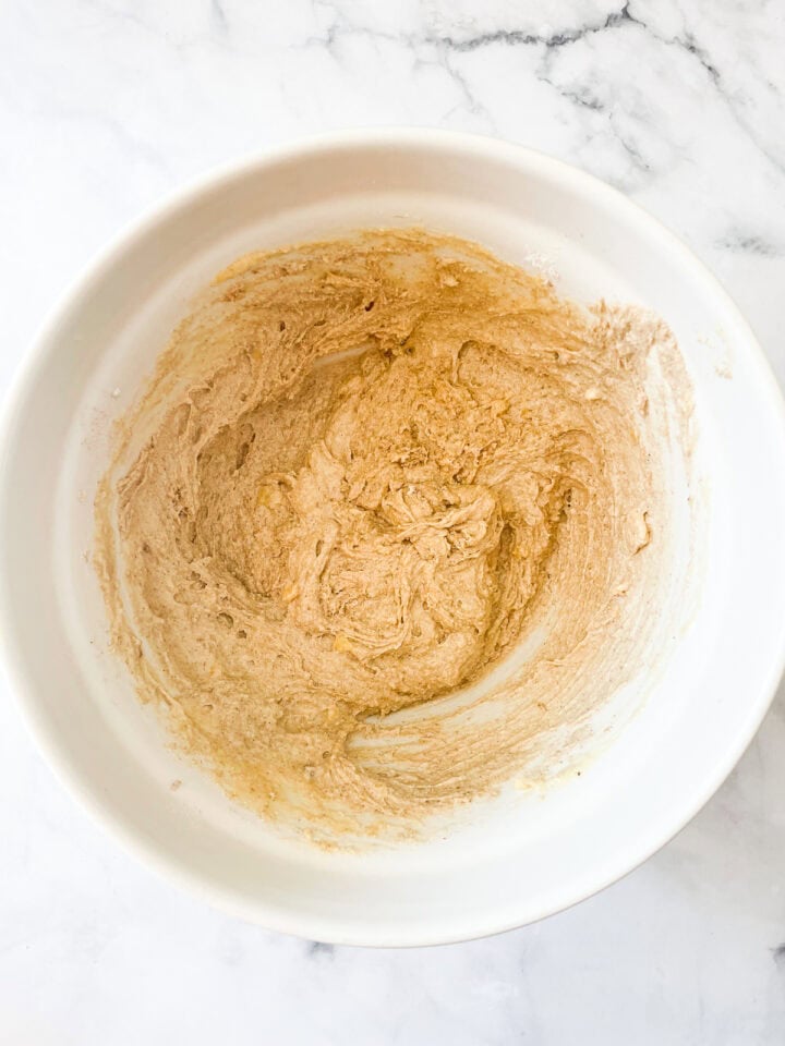 Wet and dry ingredients combined in a bowl.