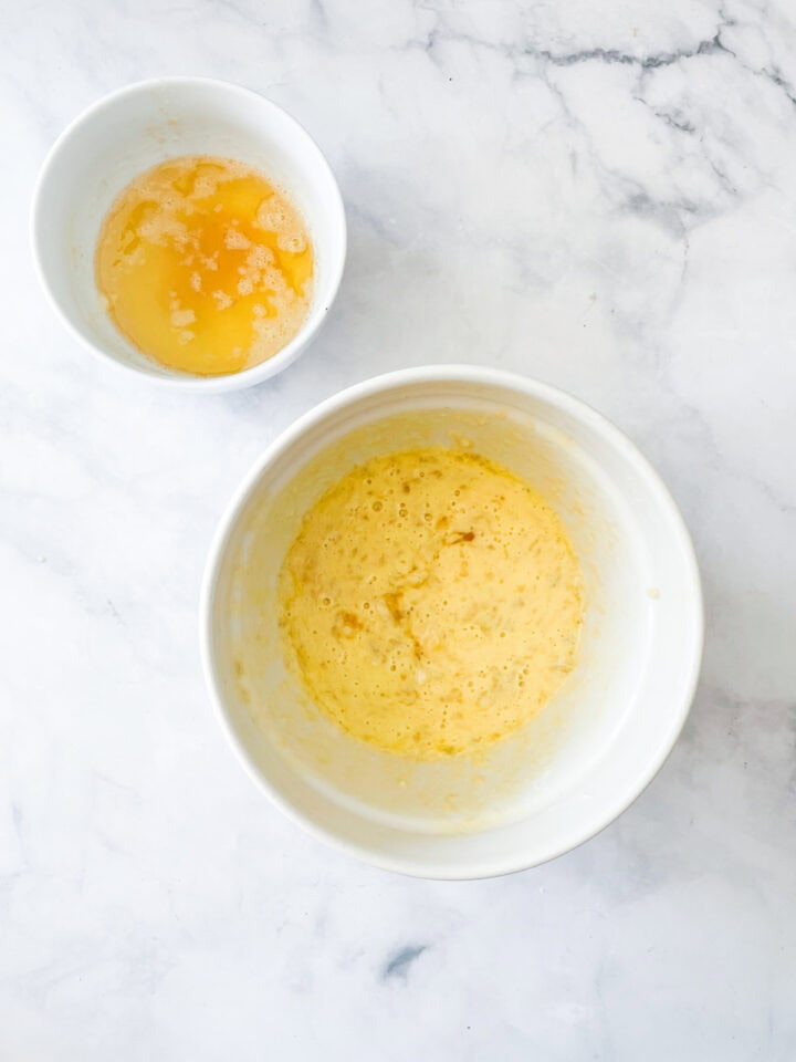 Browned butter next to a wet ingredients mix in a bowl.