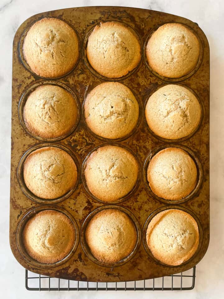 Baked gluten free chocolate chip muffins in a muffin tin.