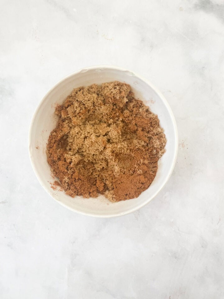 Filling for cinnamon rolls combined in a bowl.