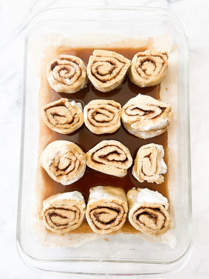 A baking pan of gluten-free cinnamon rolls before their final rise.