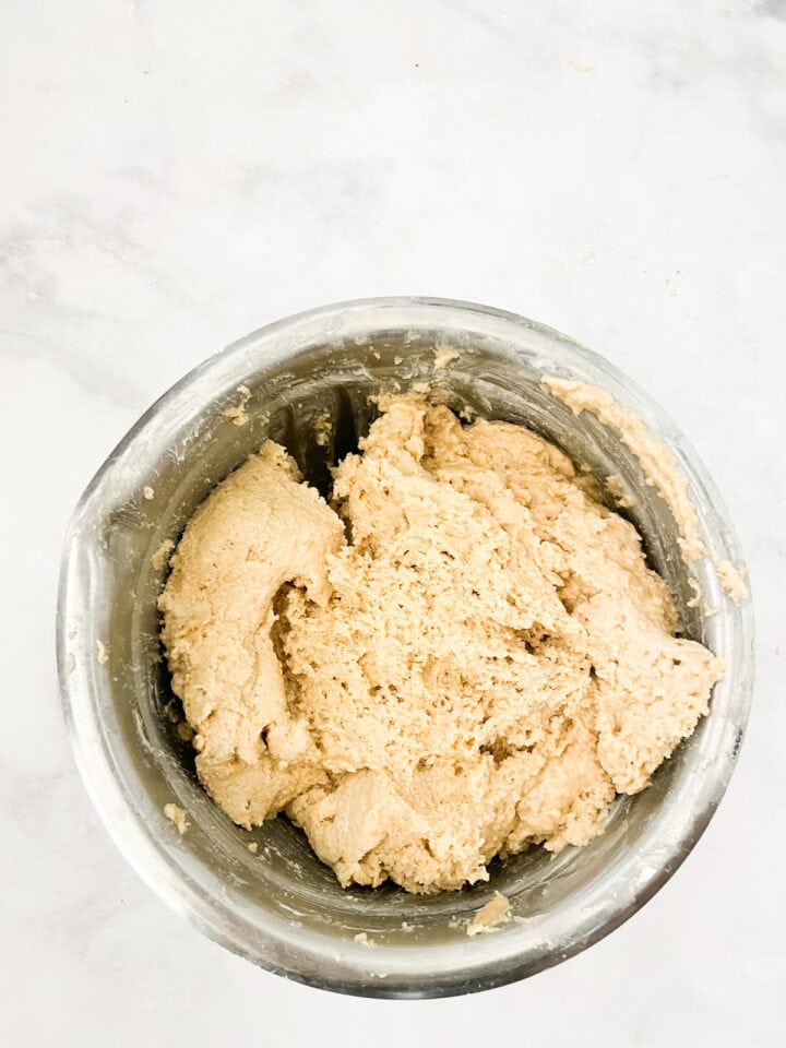 Dough after rising in a bowl.