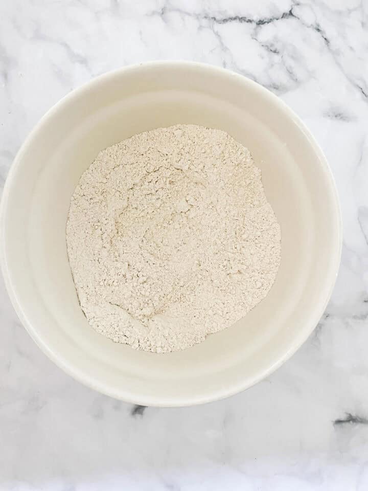 Dry mix for gluten-free cinnamon rolls in a bowl.