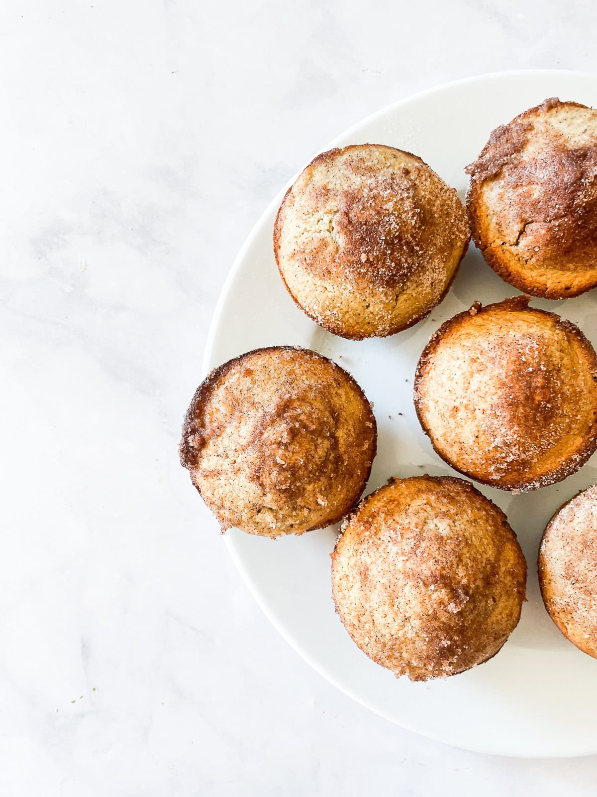 A plate of cinnamon sugar muffins.