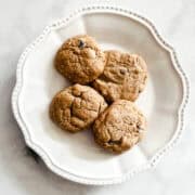 A plate of 4 low sugar chocolate chip cookies.