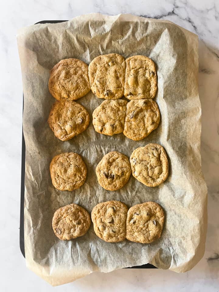 Chocolate chip cookies baked on a baking sheet.