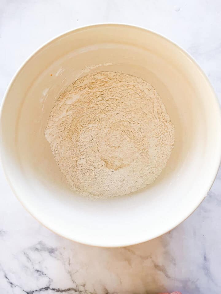 The dry mix for oat flour cinnamon rolls in a bowl.