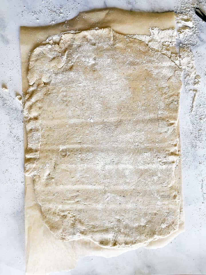 Oat flour dough rolled out into a rectangle.