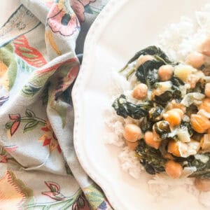 A napkin next to a plate of curried chickpeas.