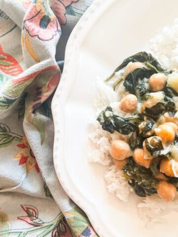 A napkin next to a plate of curried chickpeas.