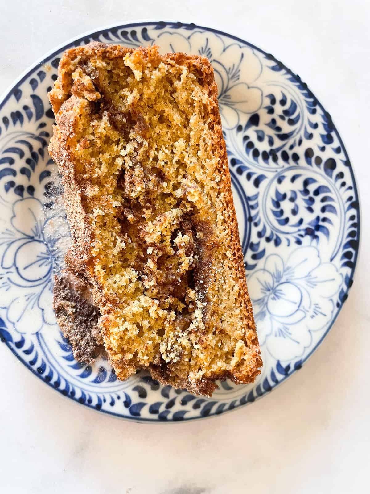 A slice of cinnamon swirl bread on a plate.