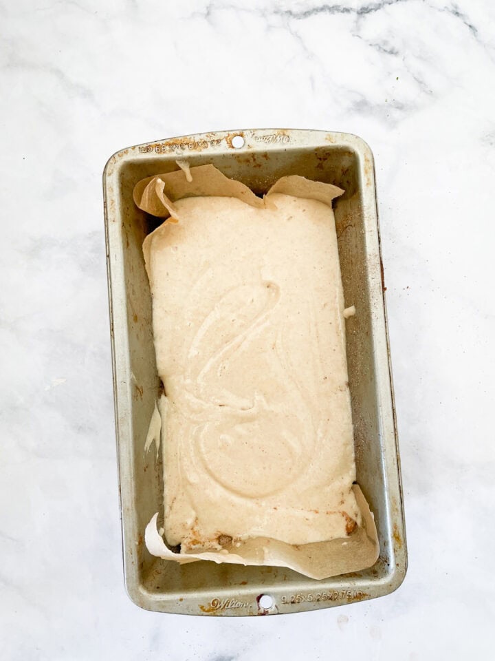 Cinnamon swirl bread batter in a loaf pan.