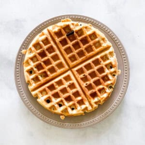 A waffle on a plate.