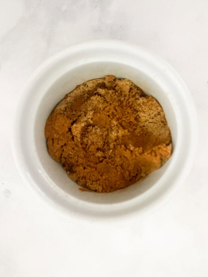 Cinnamon and sugar mixed together in a bowl.