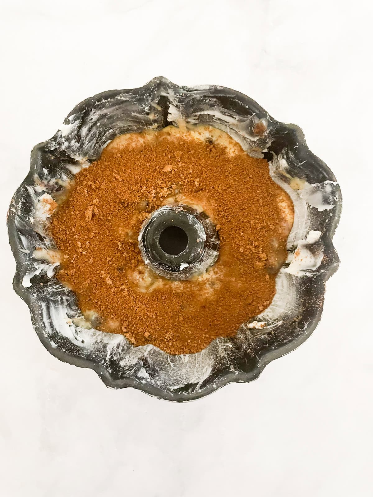 This luscious gluten free blueberry yogurt cake is packed with bright, juicy berries and run through with a brown sugar-cinnamon swirl. A layer of cinnamon sugar added to cake batter.