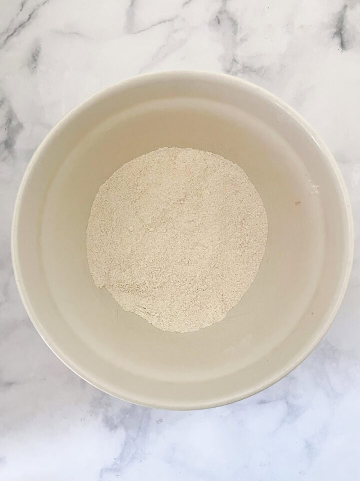 Dry ingredients for blackberry muffins in a bowl.