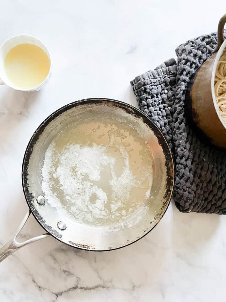 Butter is melted in a skillet.