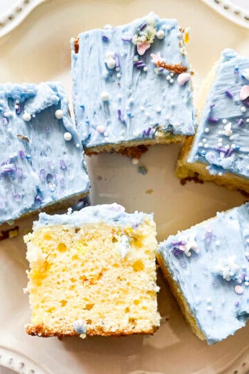 A unicorn bar turned on its side on a plate with more bars.