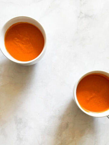 Two cups of vegetarian cream of tomato soup.