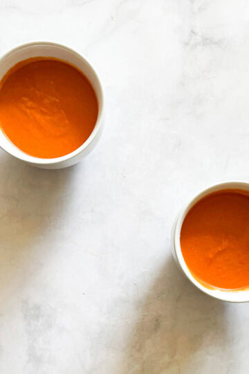 Two cups of vegetarian cream of tomato soup.