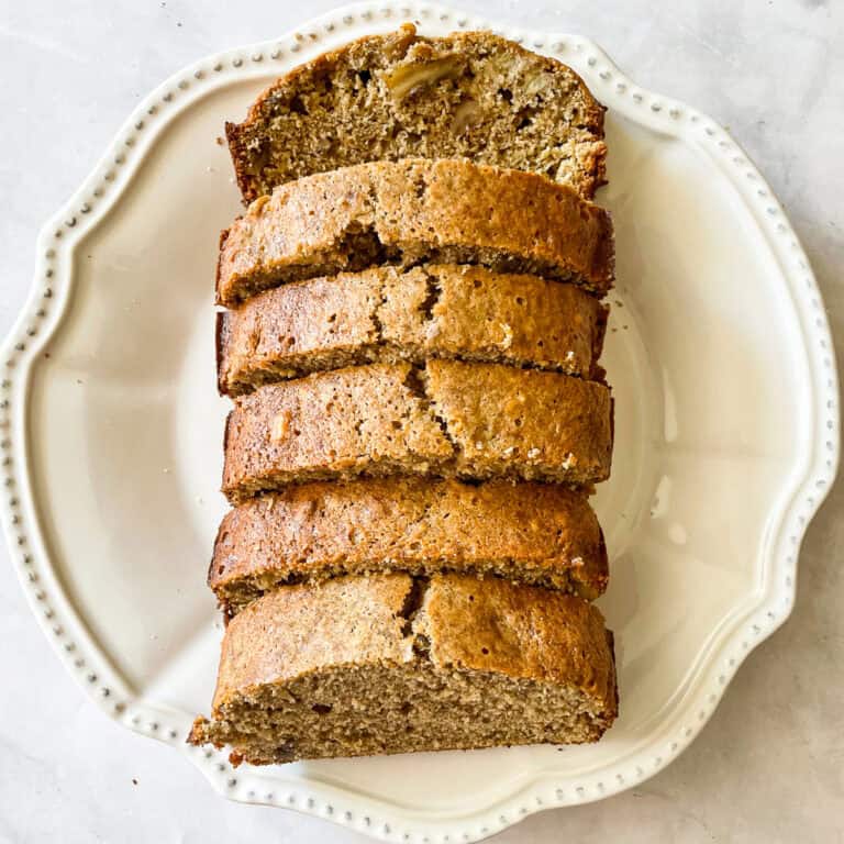 Slices of banana nut bread on a plate.