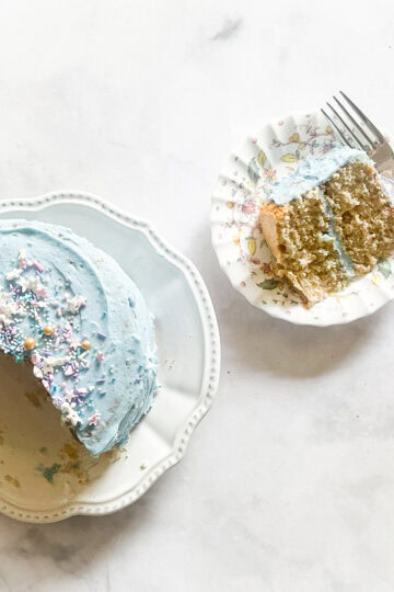 A buttermilk cake with a slice of cake on a plate.