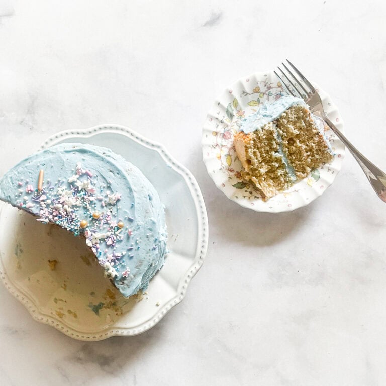 A buttermilk cake with a slice of cake on a plate.