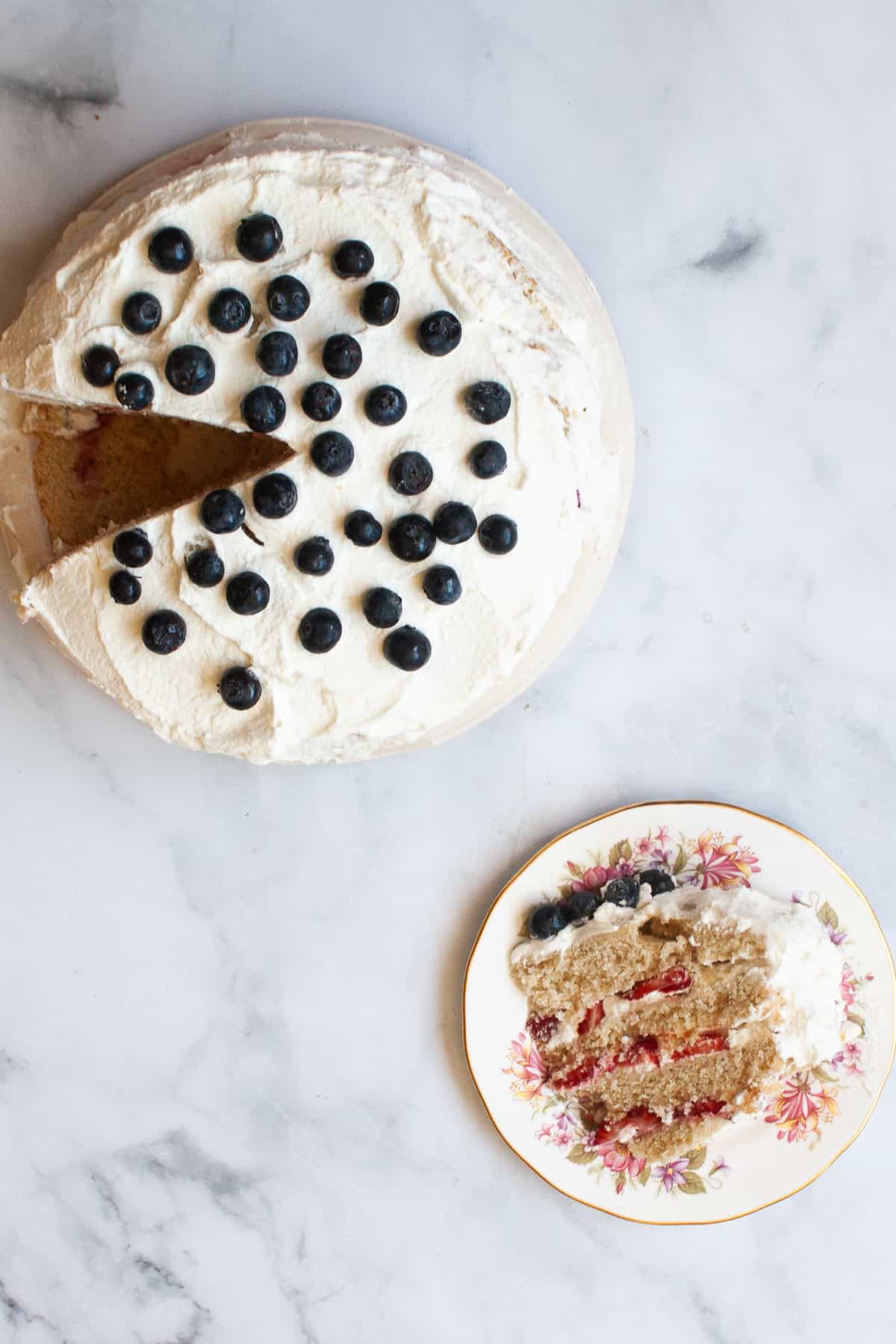A guide to naturally gluten free flours. Whole grain, starchy, and nut flours are detailed, plus baking tips and how to use them. A piece of cake on a plate next to a cake.