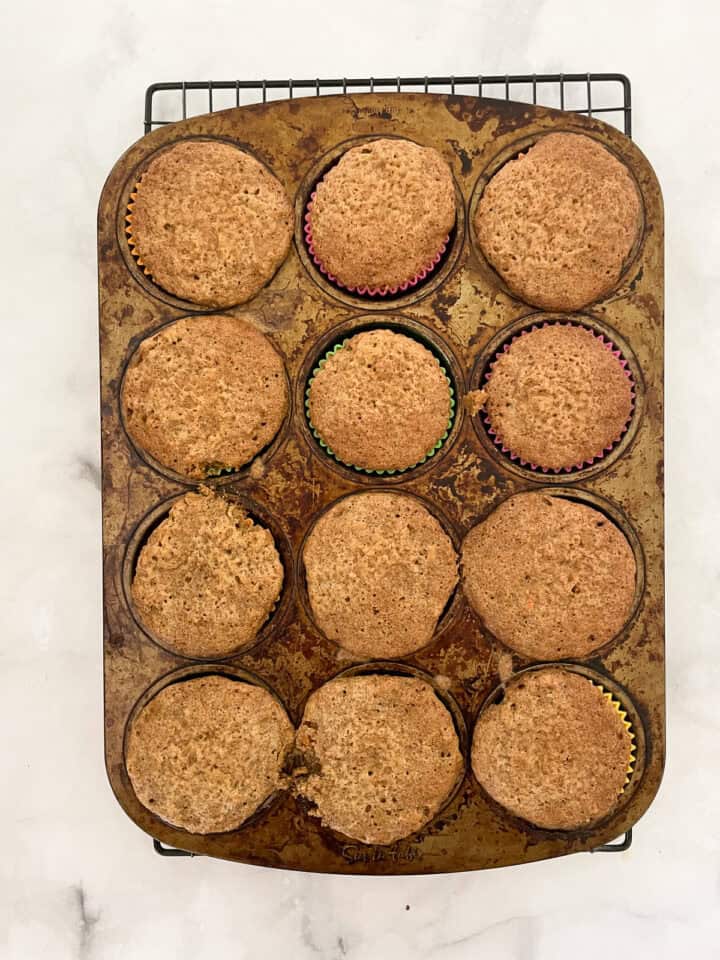 Carrot cake cupcakes cool in the cupcake tin.