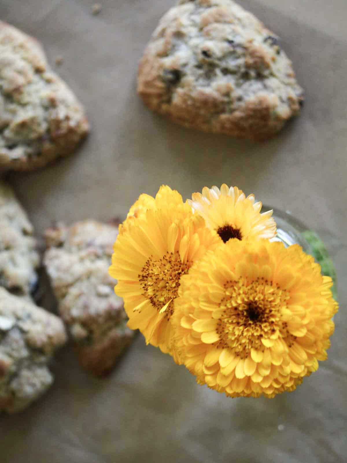 Flowers and a tray of scones.