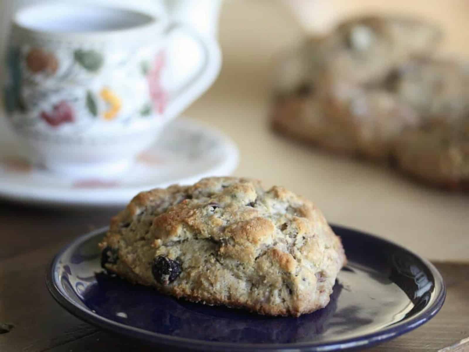 A berry buckwheat scone on a plate.