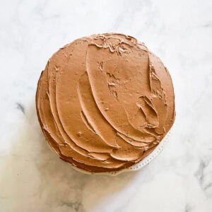 A chocolate frosted gluten-free birthday cake.